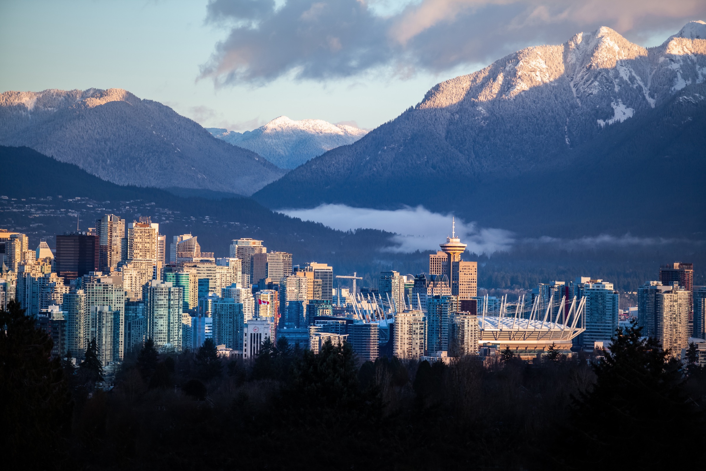 Downtown Vancouver skyline with snow-capped North Shore mountains behind